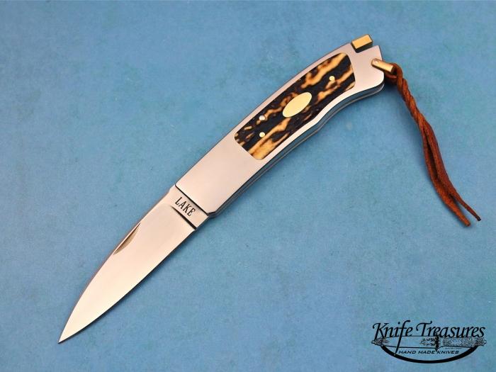 Custom Folding-Inter-Frame, Tail Lock, ATS-34 Stainless Steel, Amber Stag Knife made by Ron Lake
