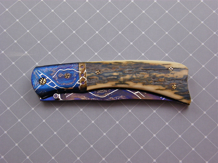 Custom Folding-Bolster, Liner Lock, Blued damascus by Maker, Fossilized Mammoth Knife made by Josh Smith
